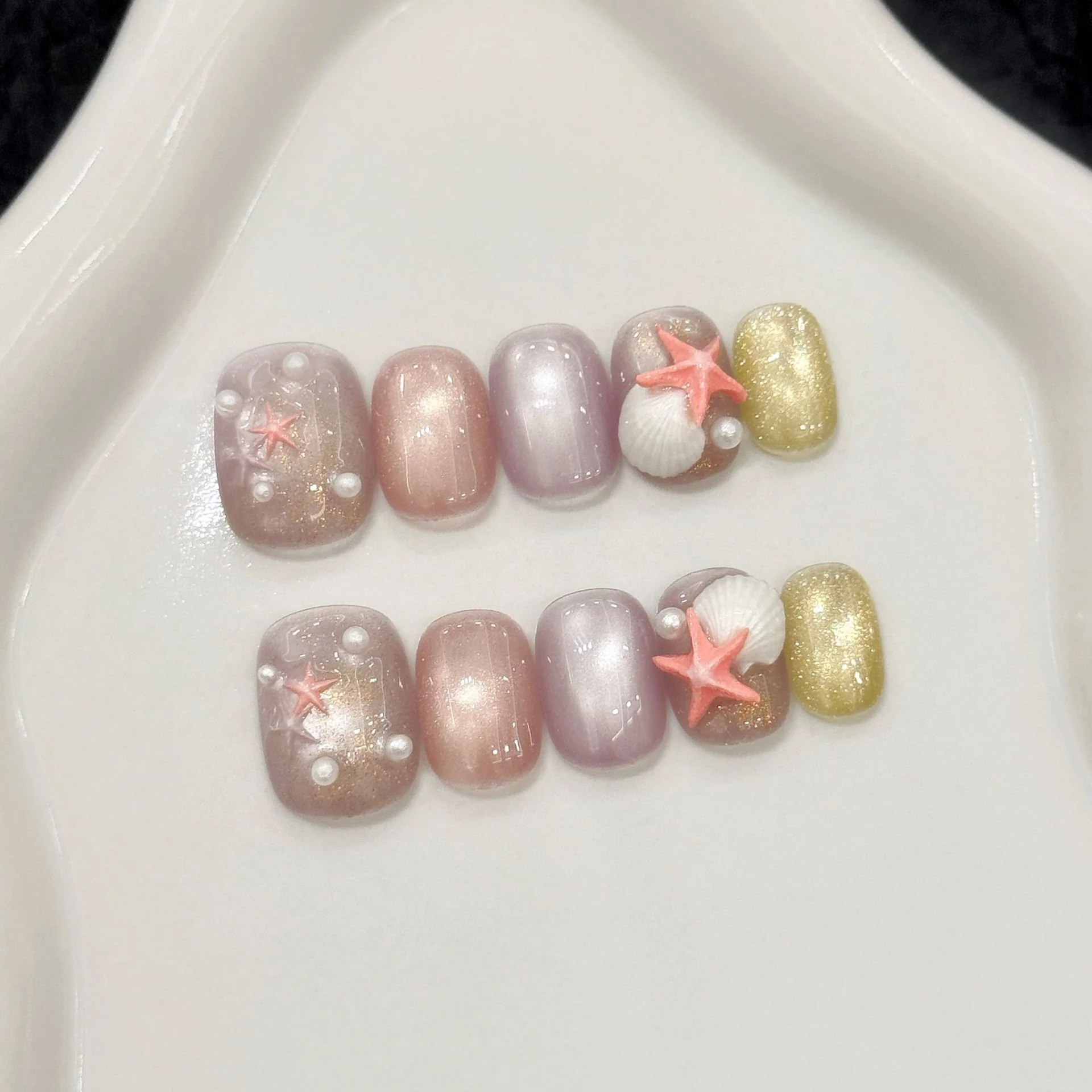 Elegant nail set featuring starfish design